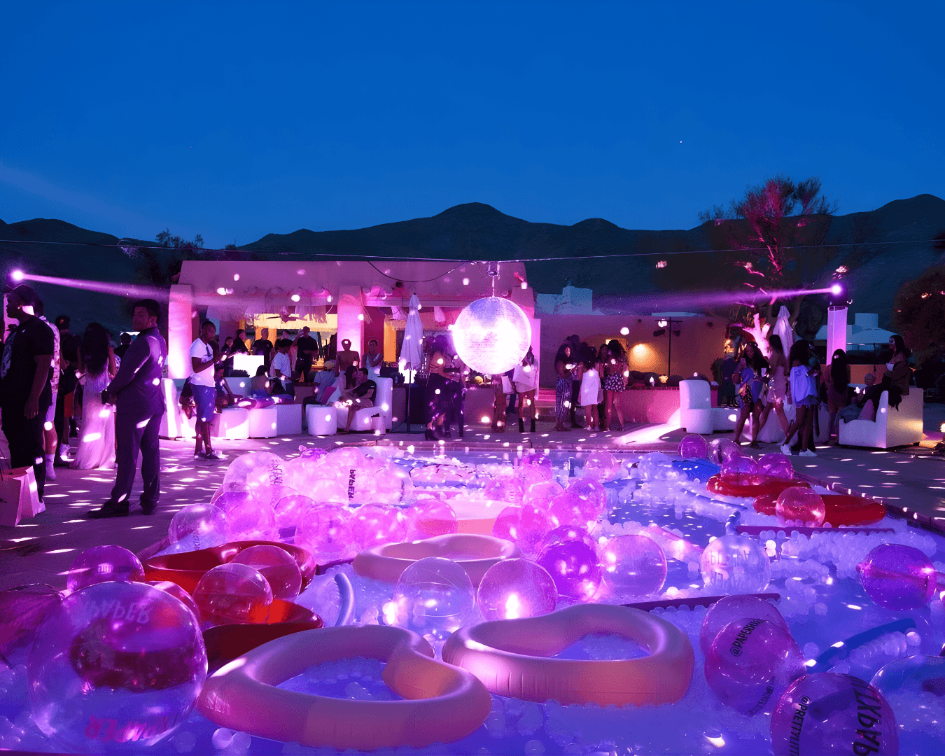 Night pool party with colorful lights